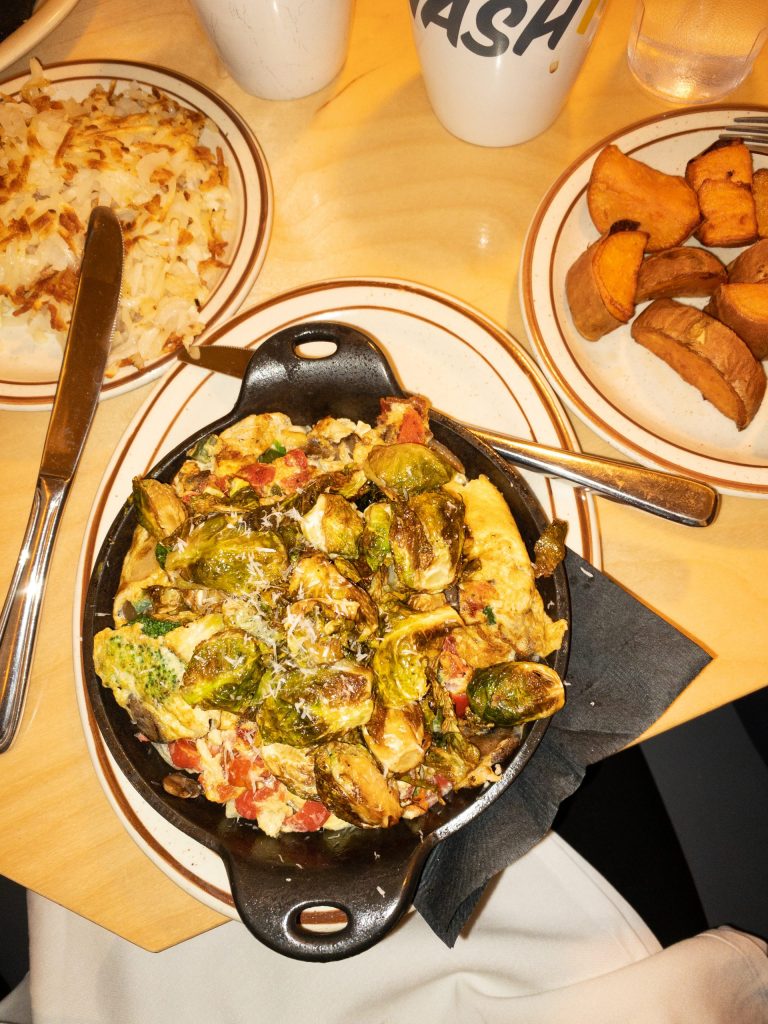 breakfast skillet with brussel sprouts, eggs, tomatoes, mushrooms, and broccolli